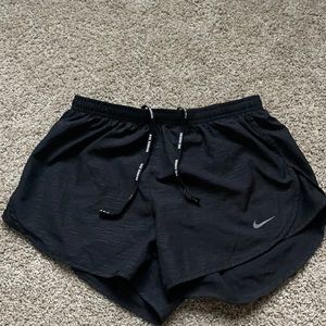 Black Nike running shorts